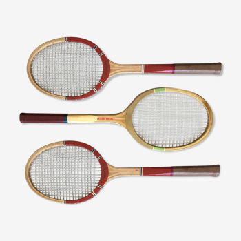 Three old tennis rackets