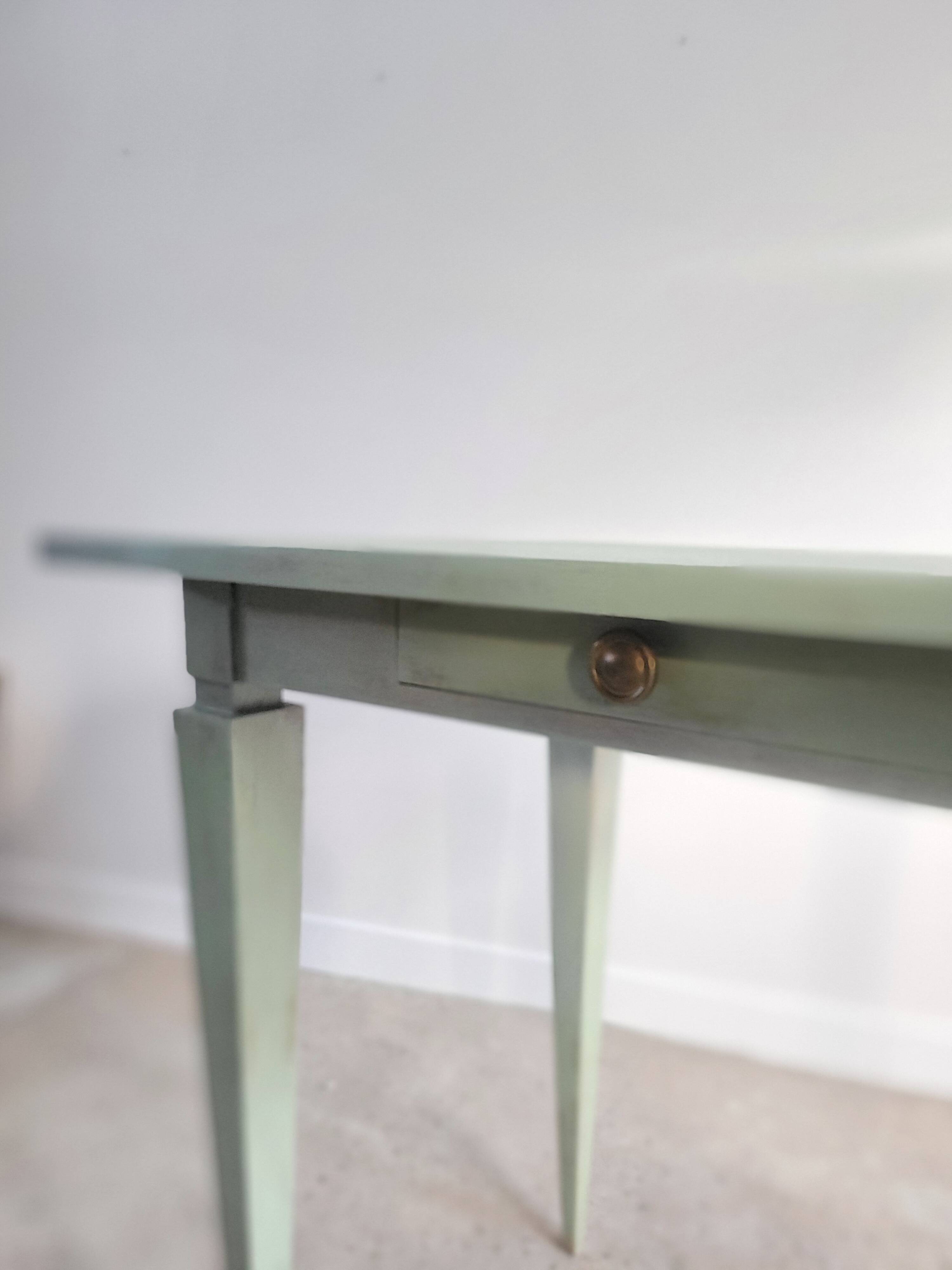 Green side table with tapered legs