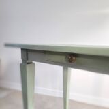 Green side table with tapered legs