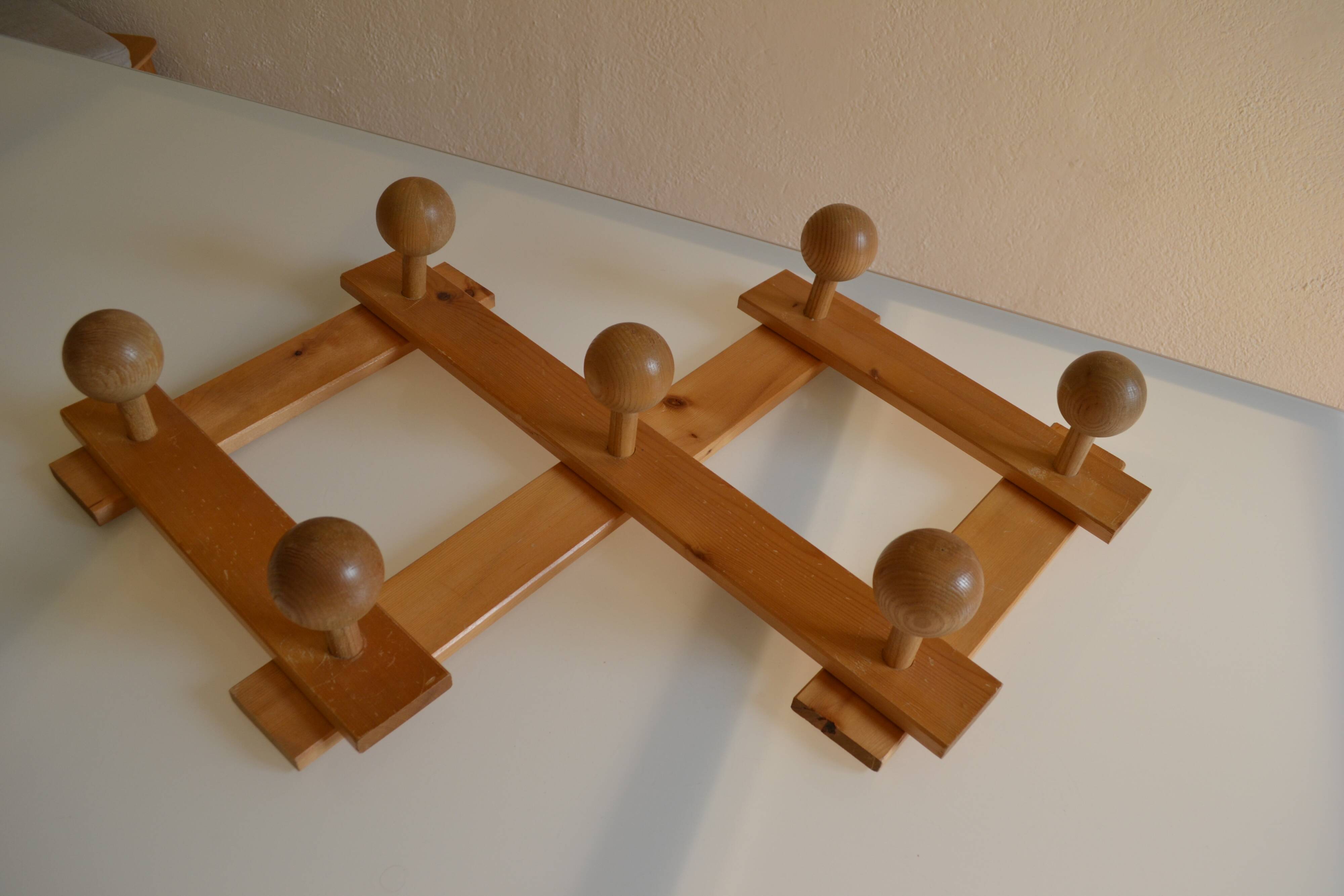 Brutalist wooden accordion wall coat rack with 7 hooks
