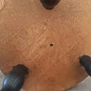 Brown and black wooden tripod stool