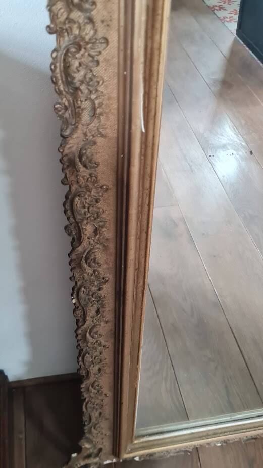 Antique Louis Philippe mirror with a pediment.