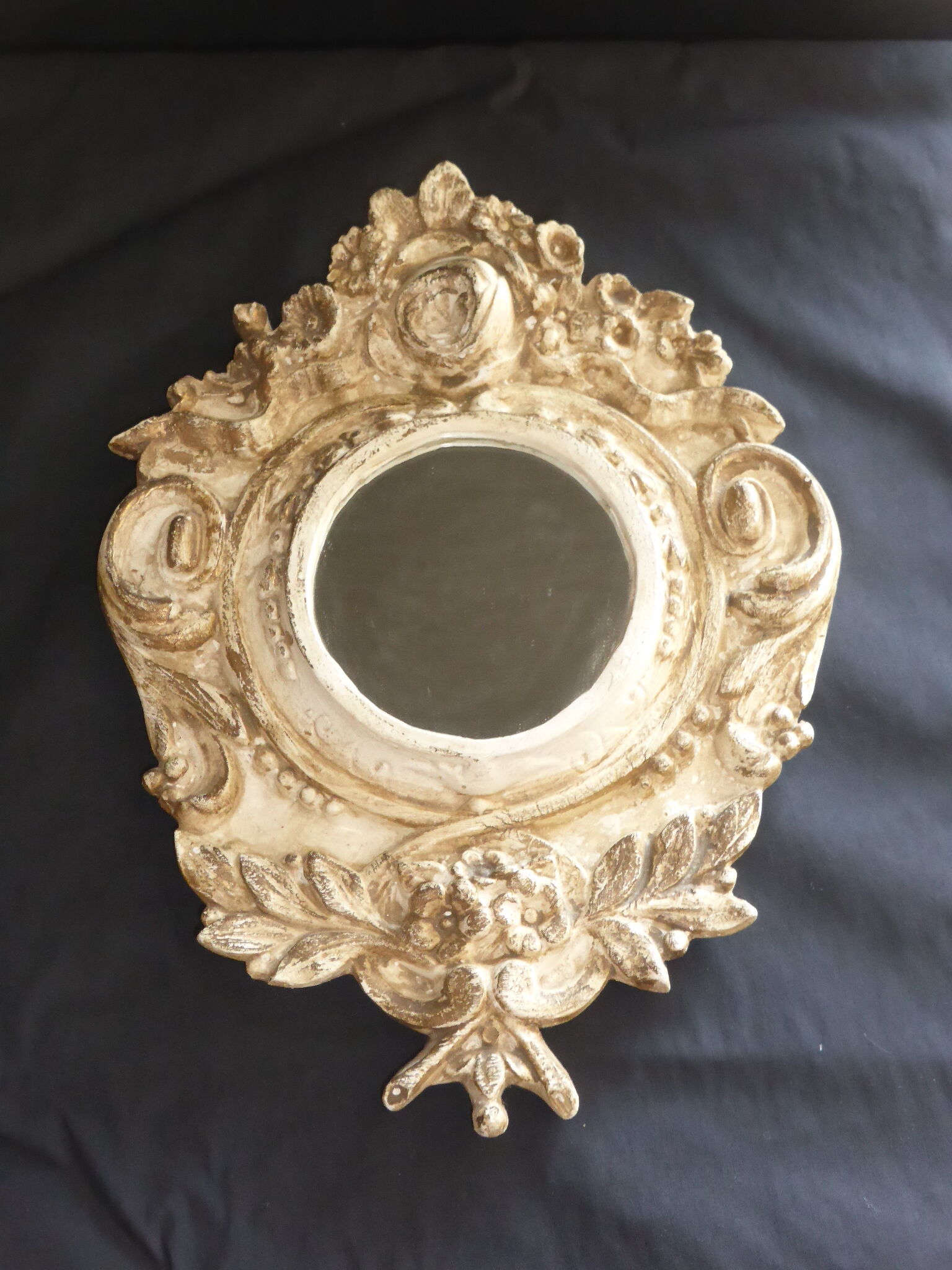 Round mirror with floral frame Style Marie-Antoinette patina in the old way