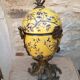 Large covered box in yellow earthenware with polychrome enamels and brass from the 20th century.