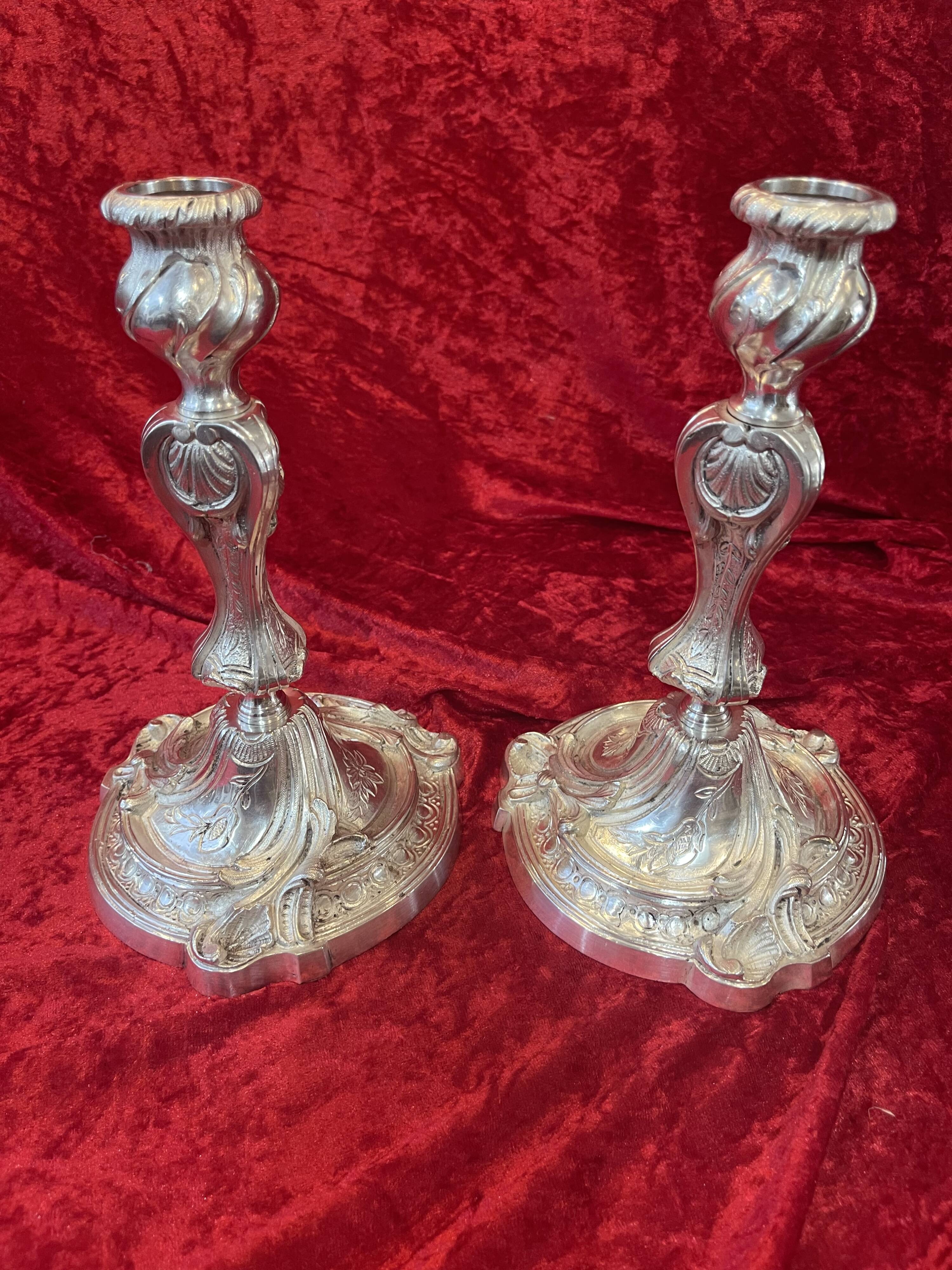 Pair of candlesticks, torches in silver bronze
