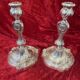 Pair of candlesticks, torches in silver bronze