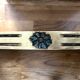 Carved wooden console and gray marble
