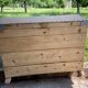 Raw wooden chest with a secret drawer