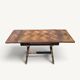 Rustic oak parquet dining table with two extensions.