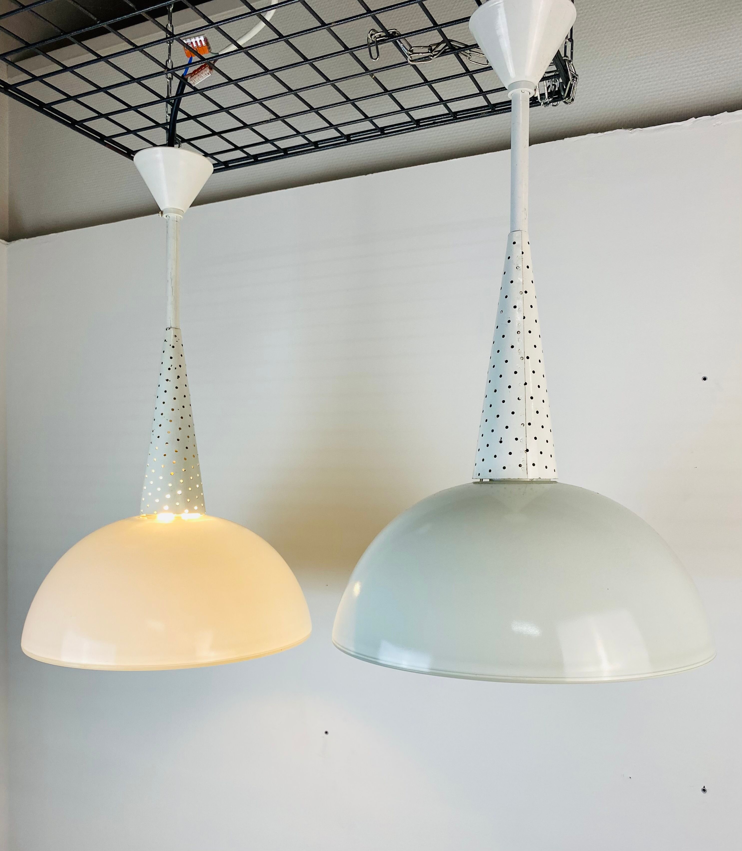 Perforated metal suspension holophanous glass