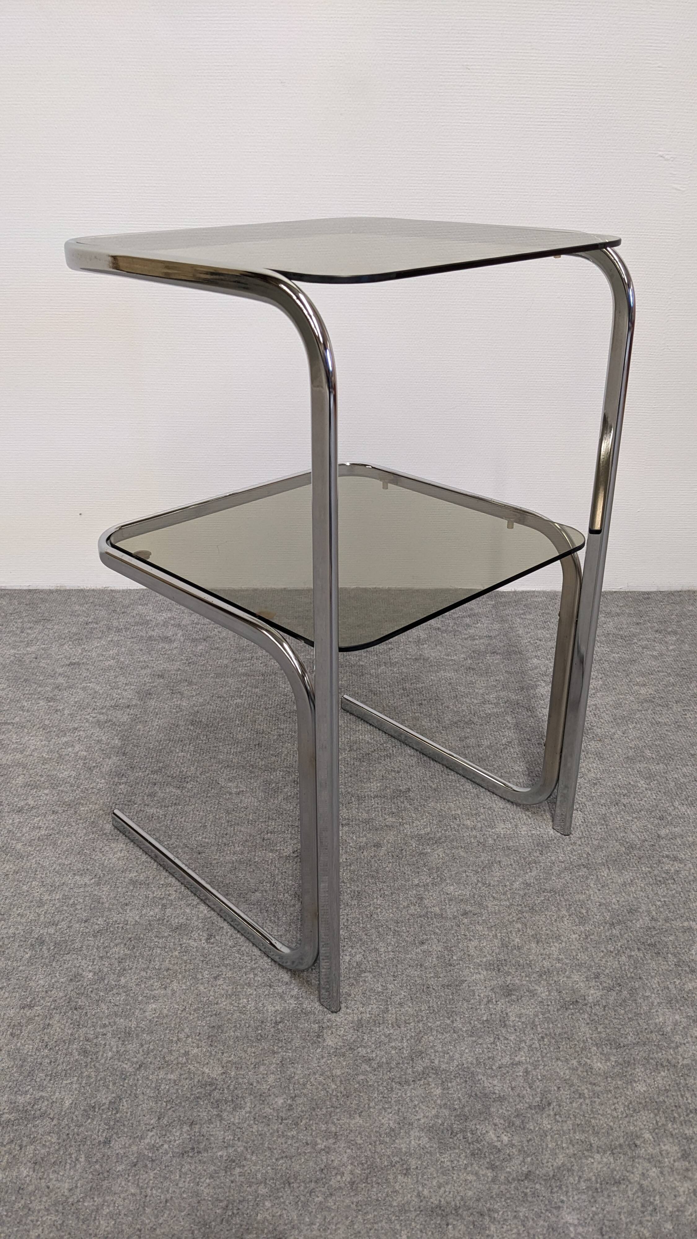 Chrome and smoked glass side table or end table, France circa 1970.