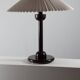Vintage table in postmodern Art Deco revival with pleated lampshade.