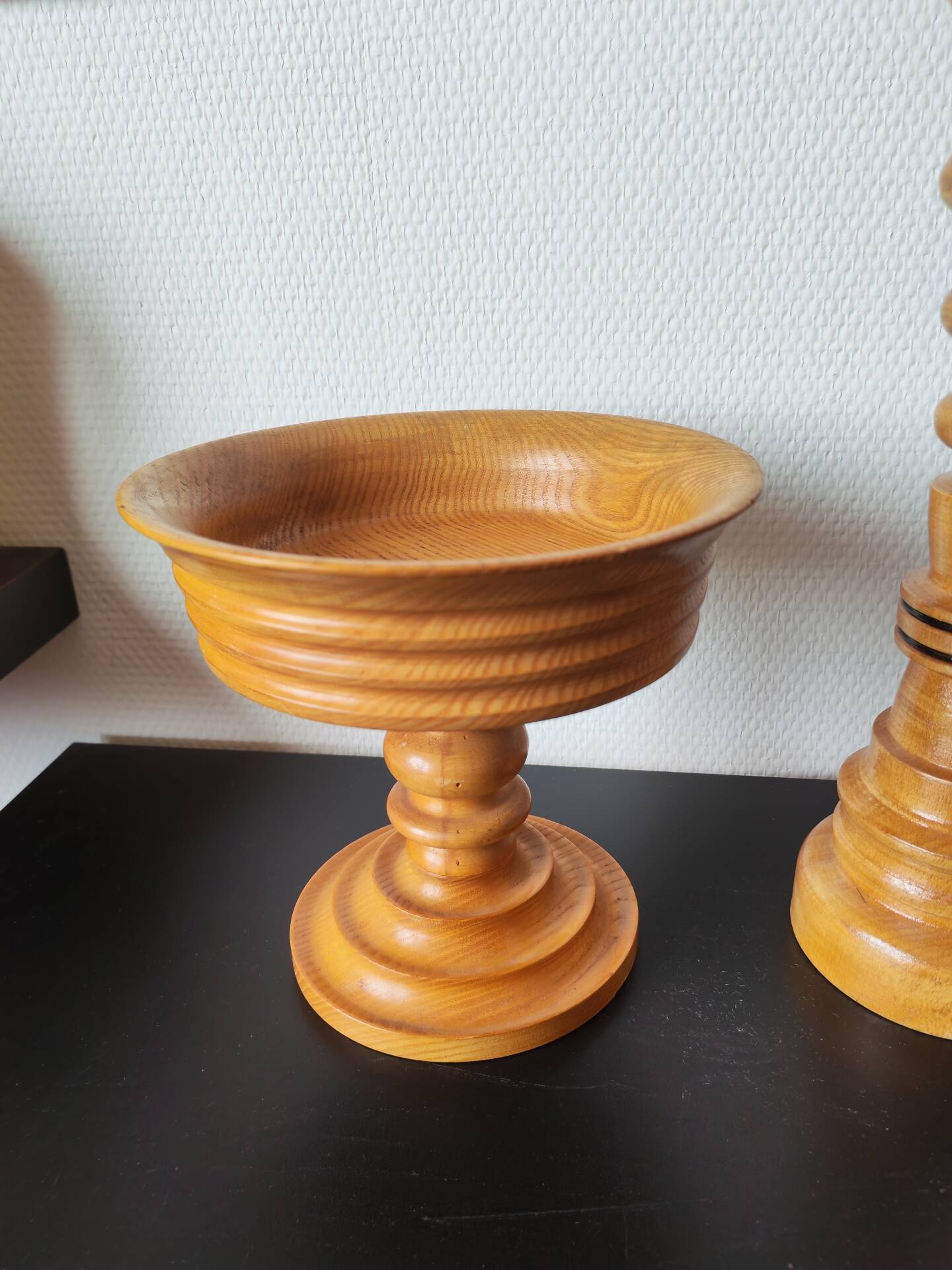 Vintage decor trio: candlestick and light wood bowls in Scandinavian style.