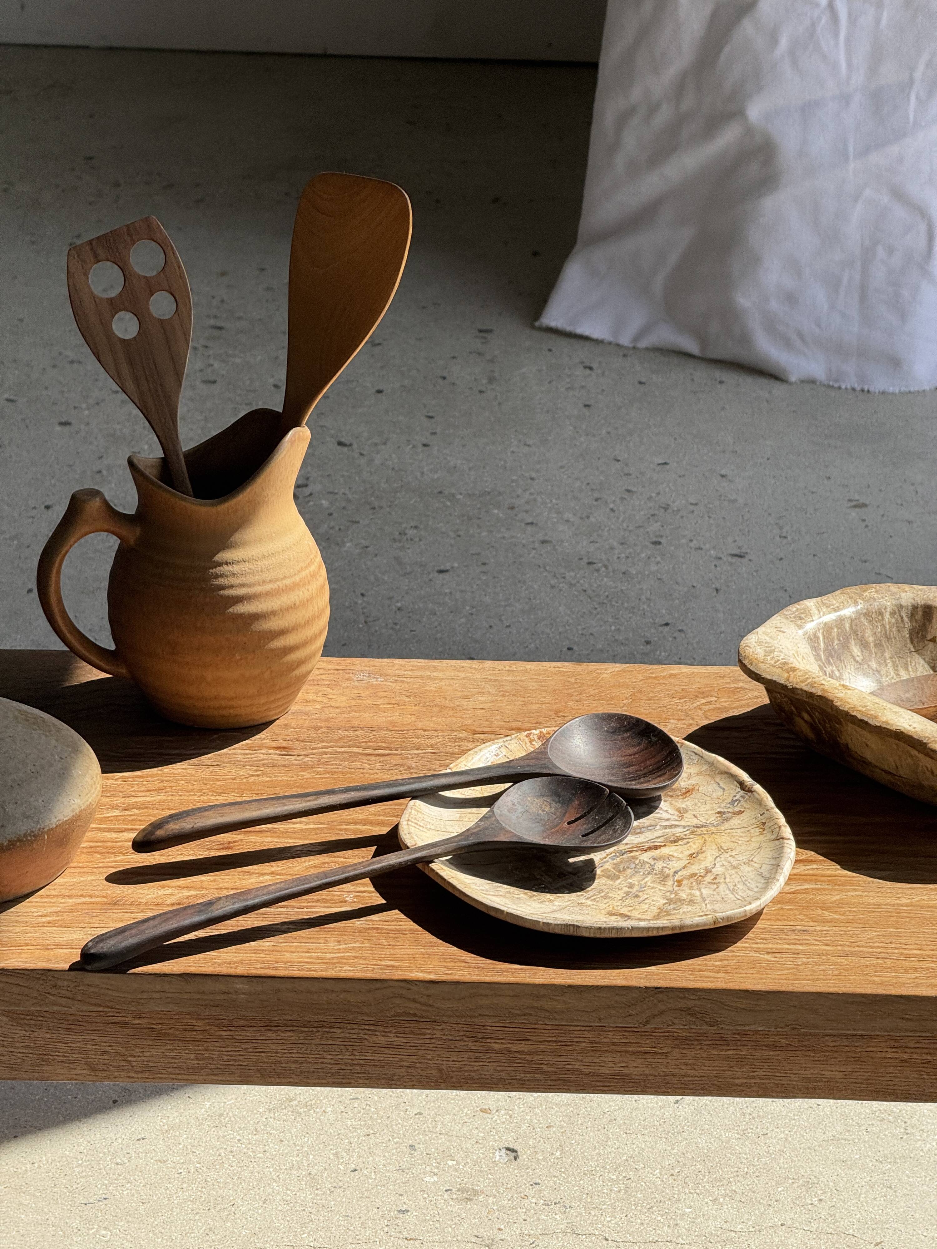 Pair of salad servers or kitchen utensils in blackened teak L30 D9