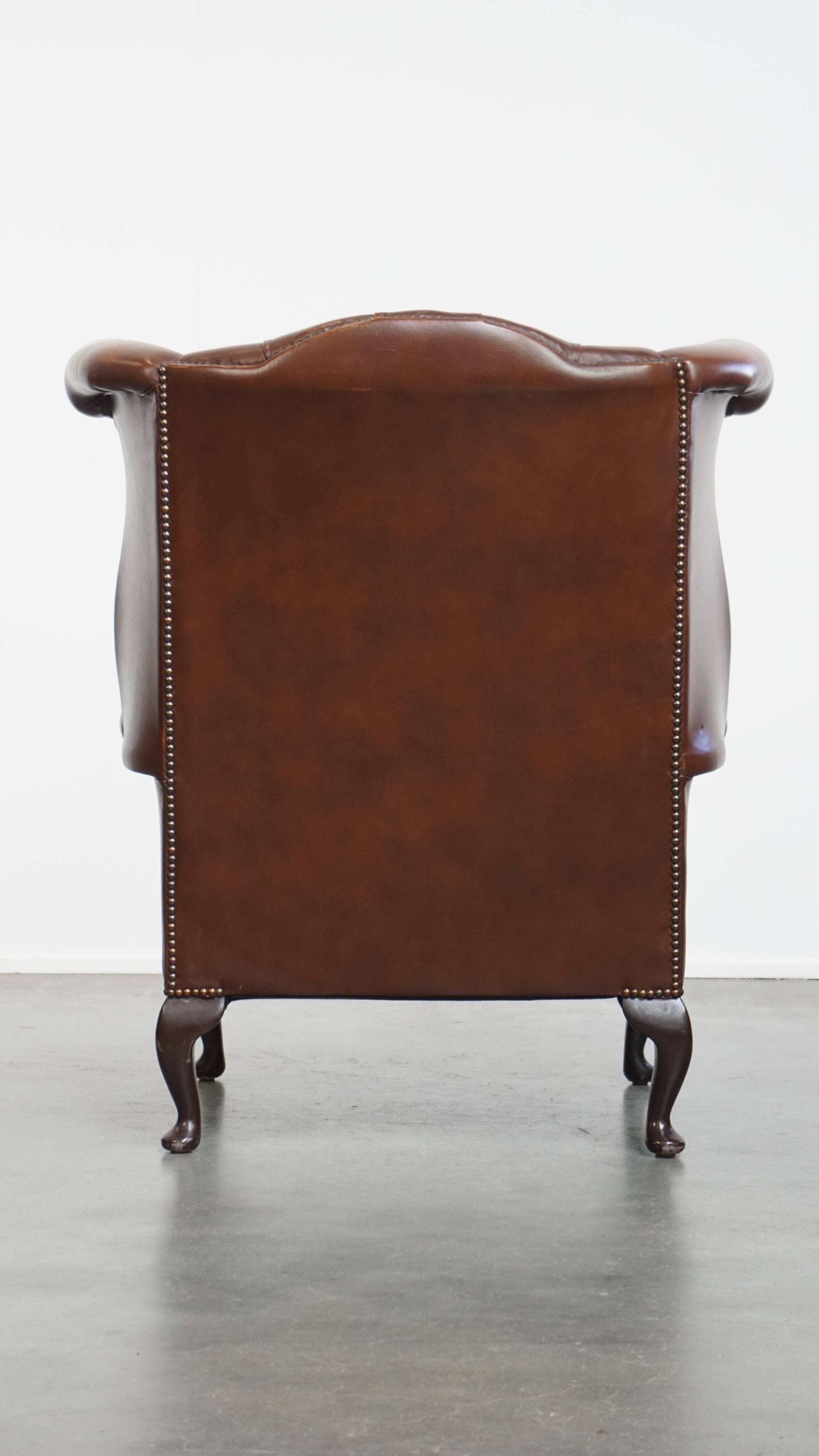 Chesterfield wing chair in dark brown English cowhide