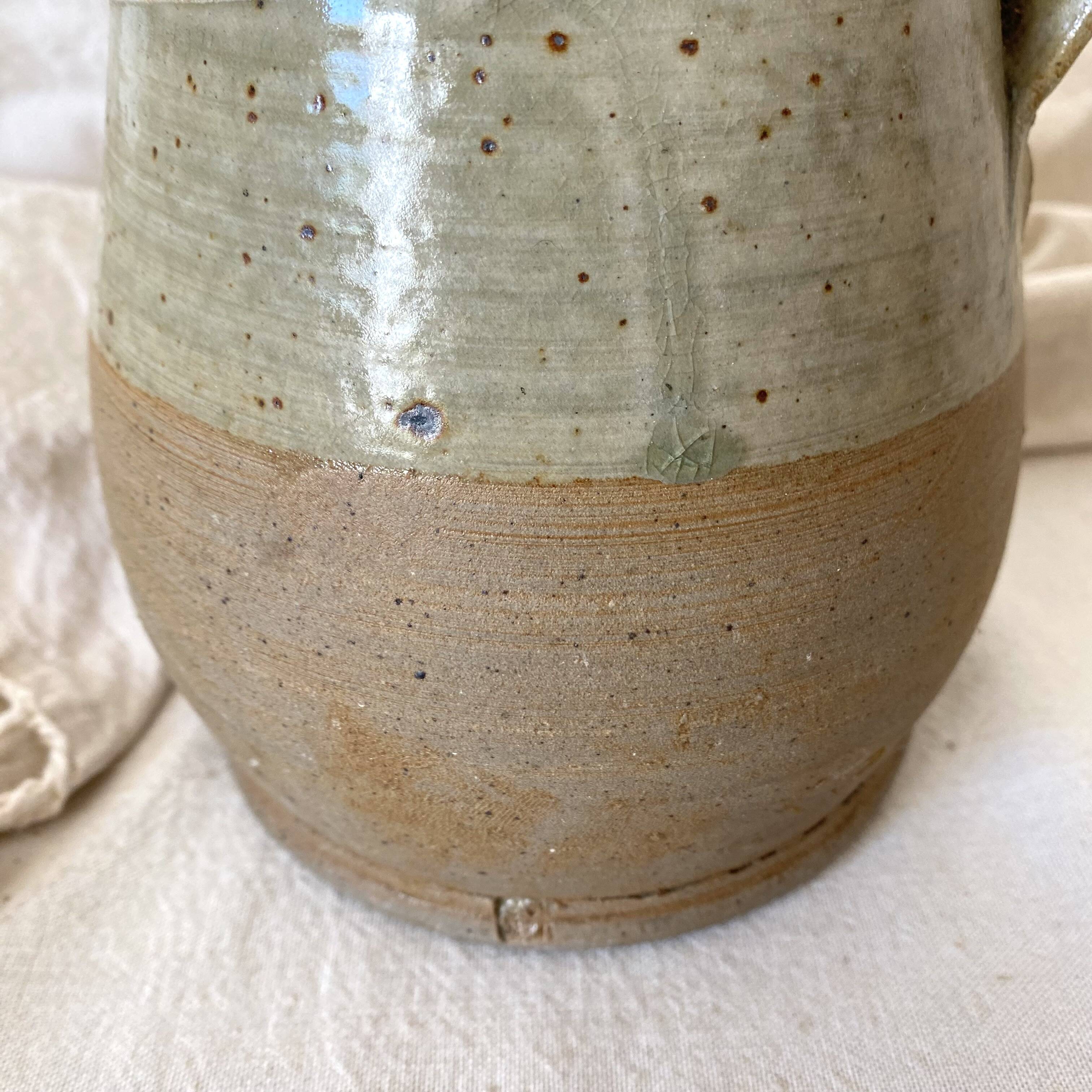 Vintage handcrafted terracotta pitcher