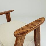 Vintage armchair with rustic wood and beige bouclé design by Chierowsky.