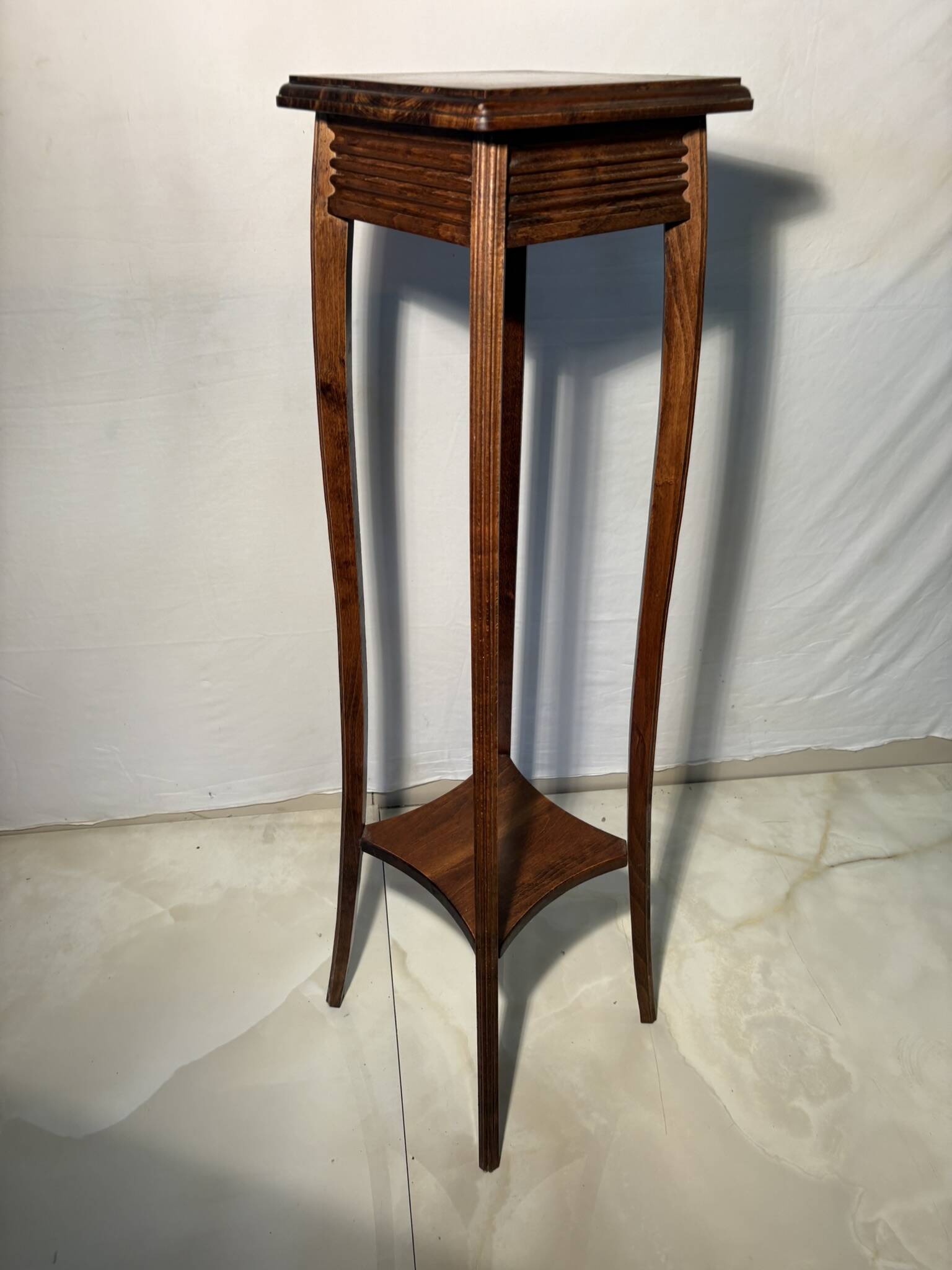 Vintage dark wood side table with curved base