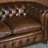 Restored leather Chesterfield sofa, walnut legs.
