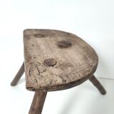 Brutalist tripod stool in solid wood half round