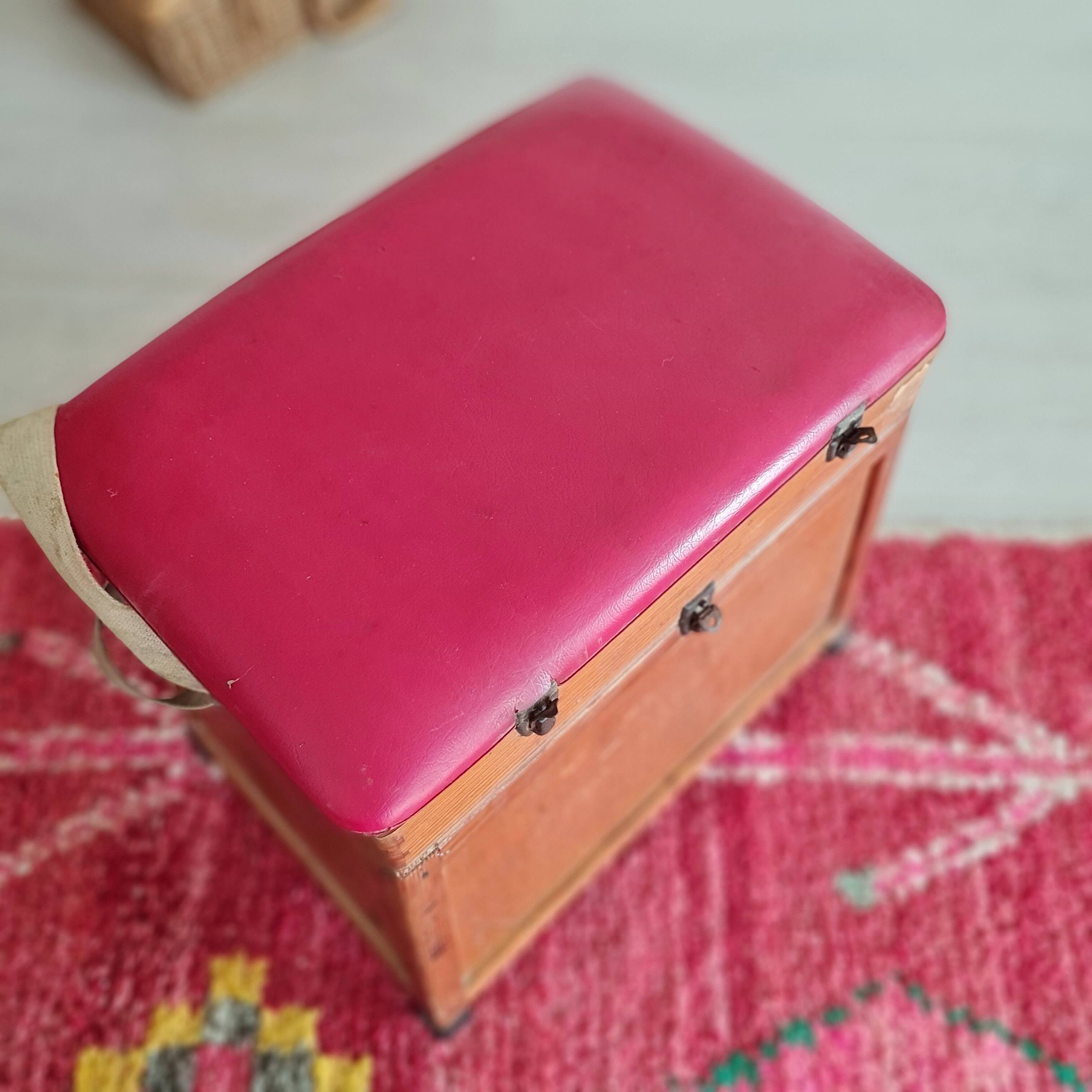 Old fisherman's stool with red seat