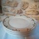 Six flat plates in faince Badonviller stylized flowers ochre and green
