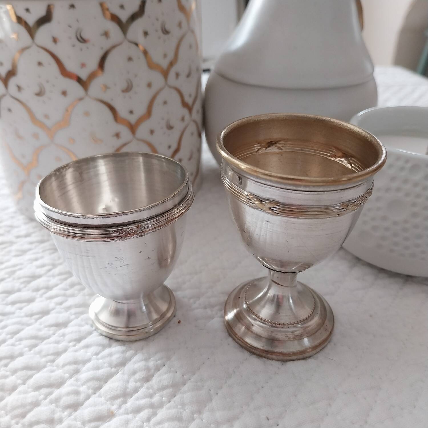 Antique egg cups on silver-plated metal stand