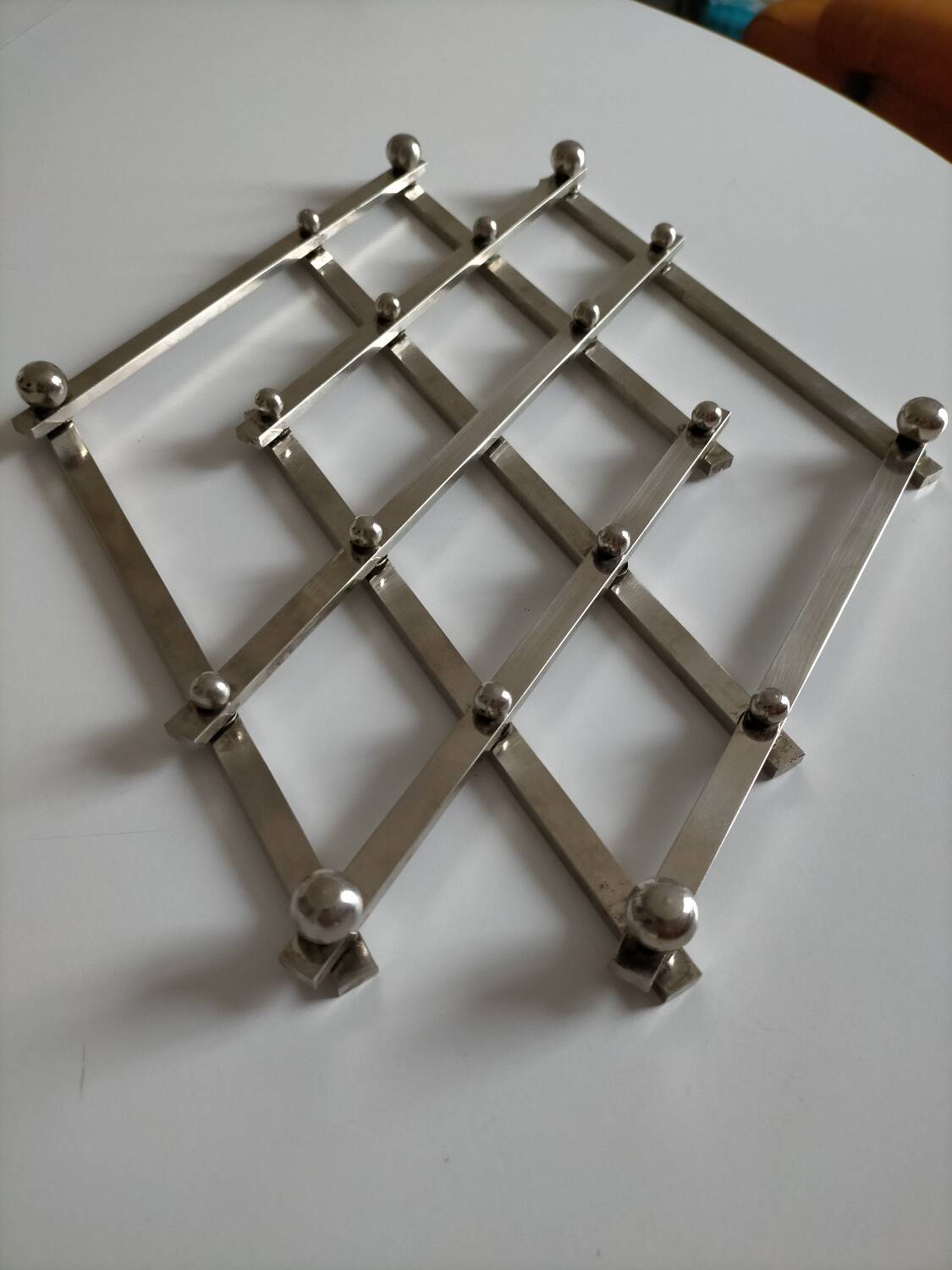 Jacques Adnet metal trivet in very good condition
