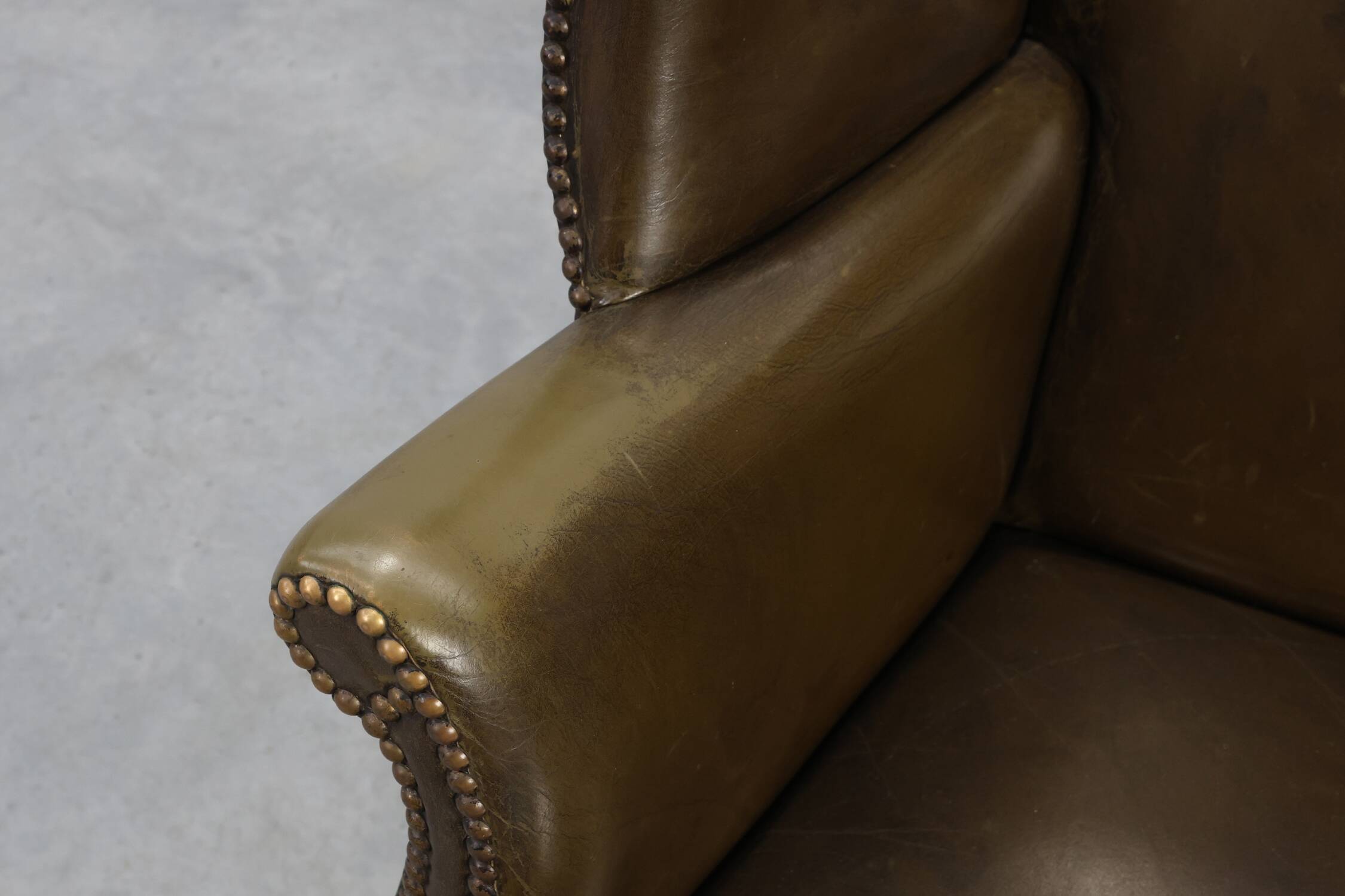Mid-century Wing Back Armchair in green leather, UK