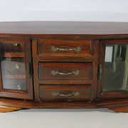 Wooden jewelry box in the shape of a dresser