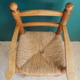 Children's high chair made of wood and straw