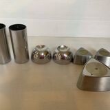 Seven different metal candle holders