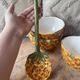 Old set of bowls and spoons in the shape of vintage pineapple