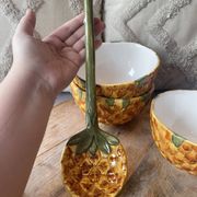 Old set of bowls and spoons in the shape of vintage pineapple