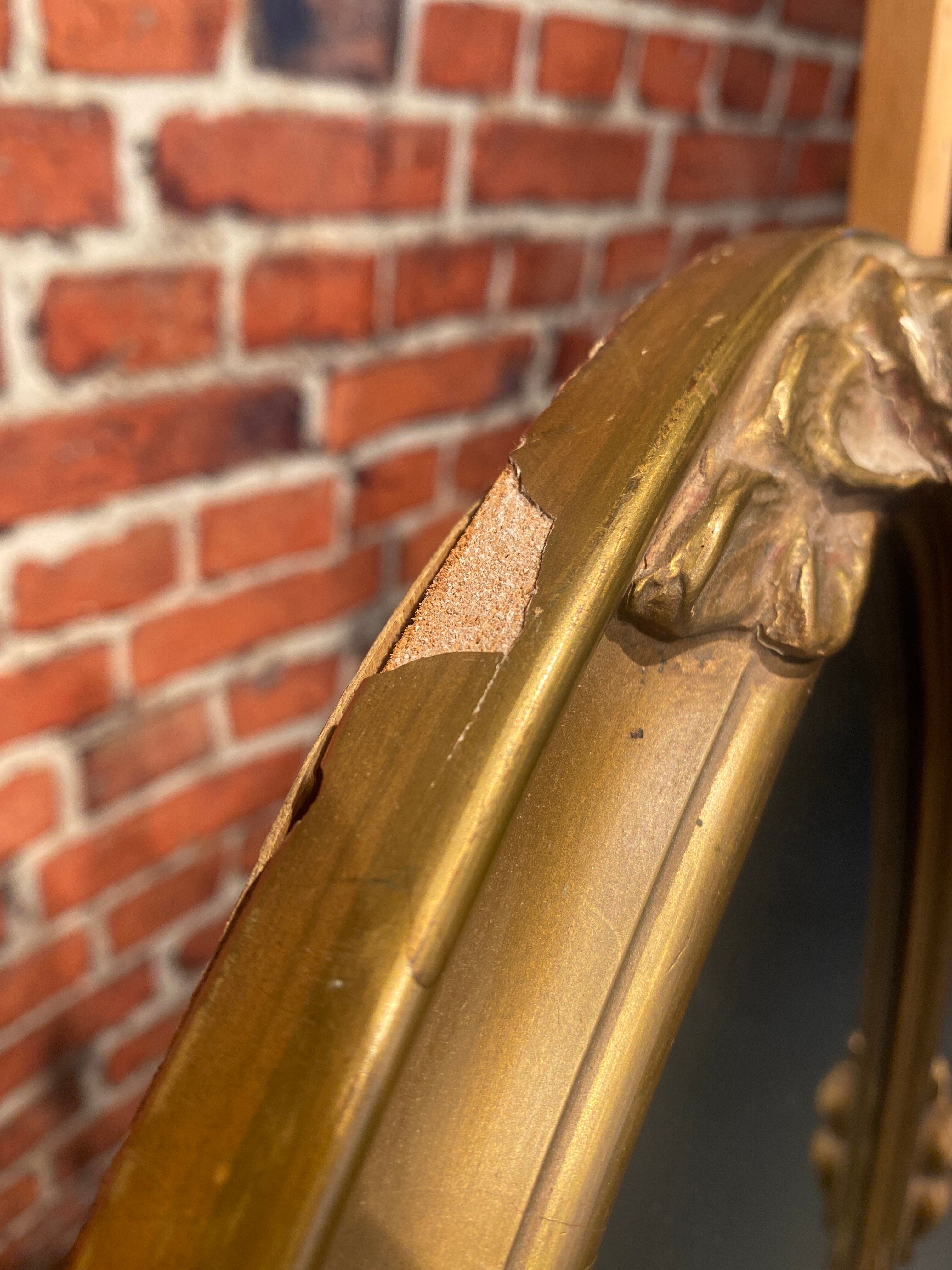 Oval mirror with wooden frame