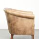 Vintage cowhide club armchair in English style in a light colour scheme