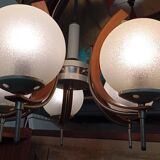 Scandinavian suspension in teak, glass, and metal.