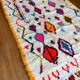 Berber carpet azimuth colored white with multicolored and fluorescent patterns