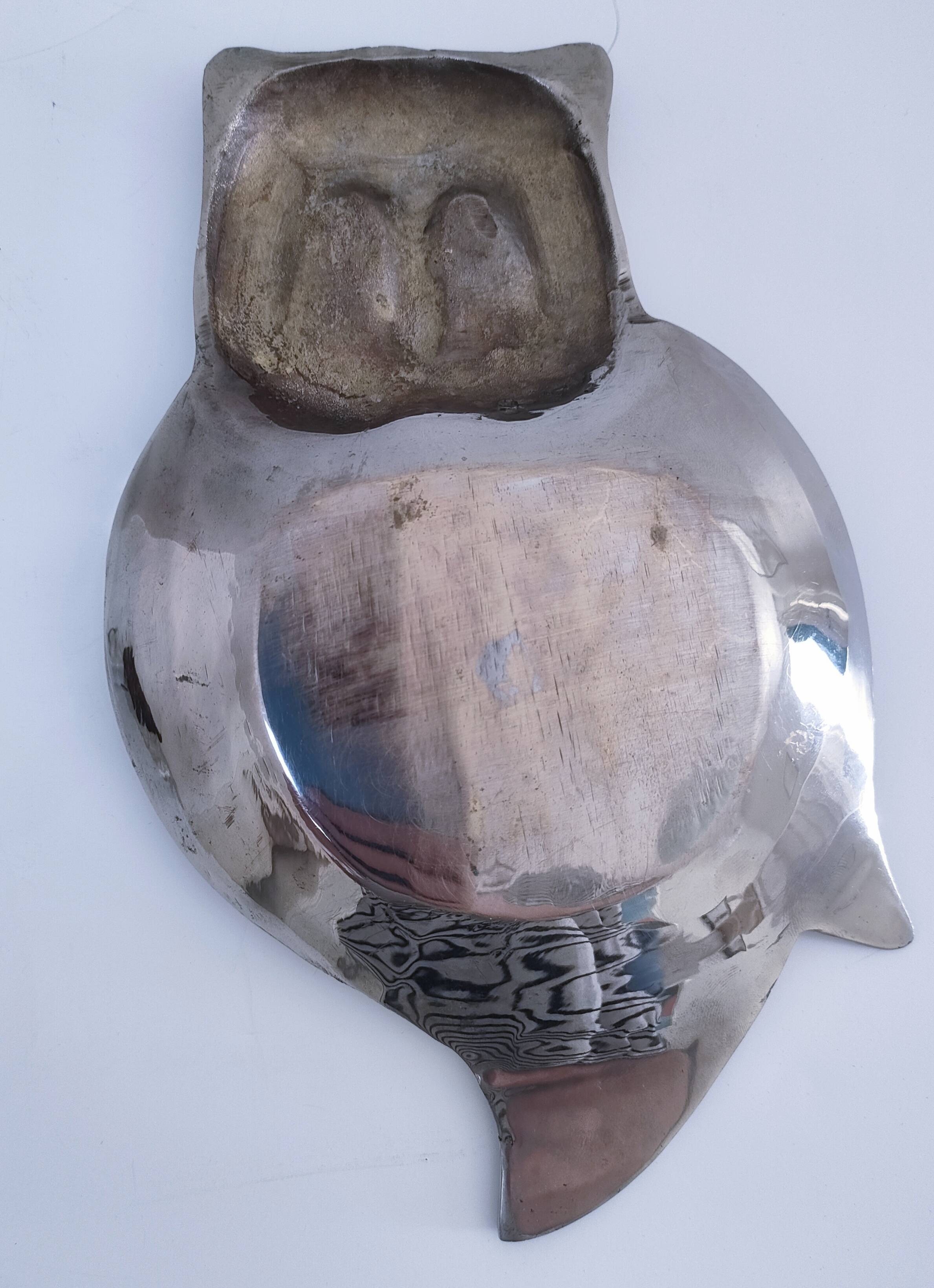 Empty pocket owl in gold and silver metal