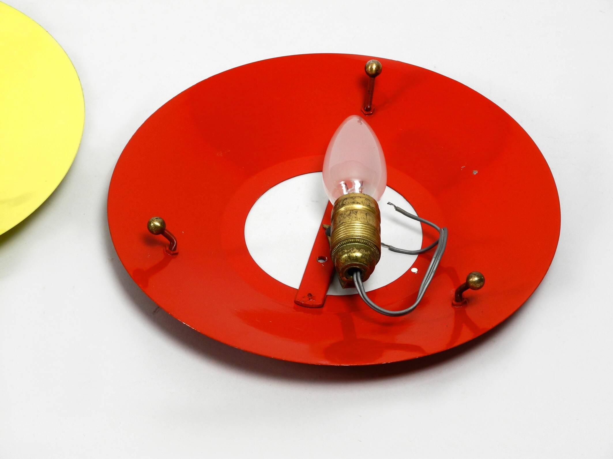 Three round 1950s wall or ceiling lamps made of metal and plexiglass shades