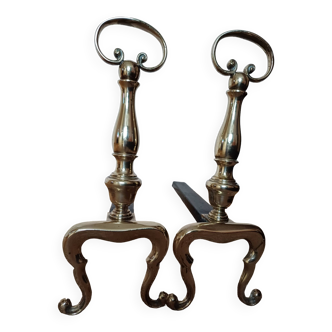 Pair of cast iron and brass andirons