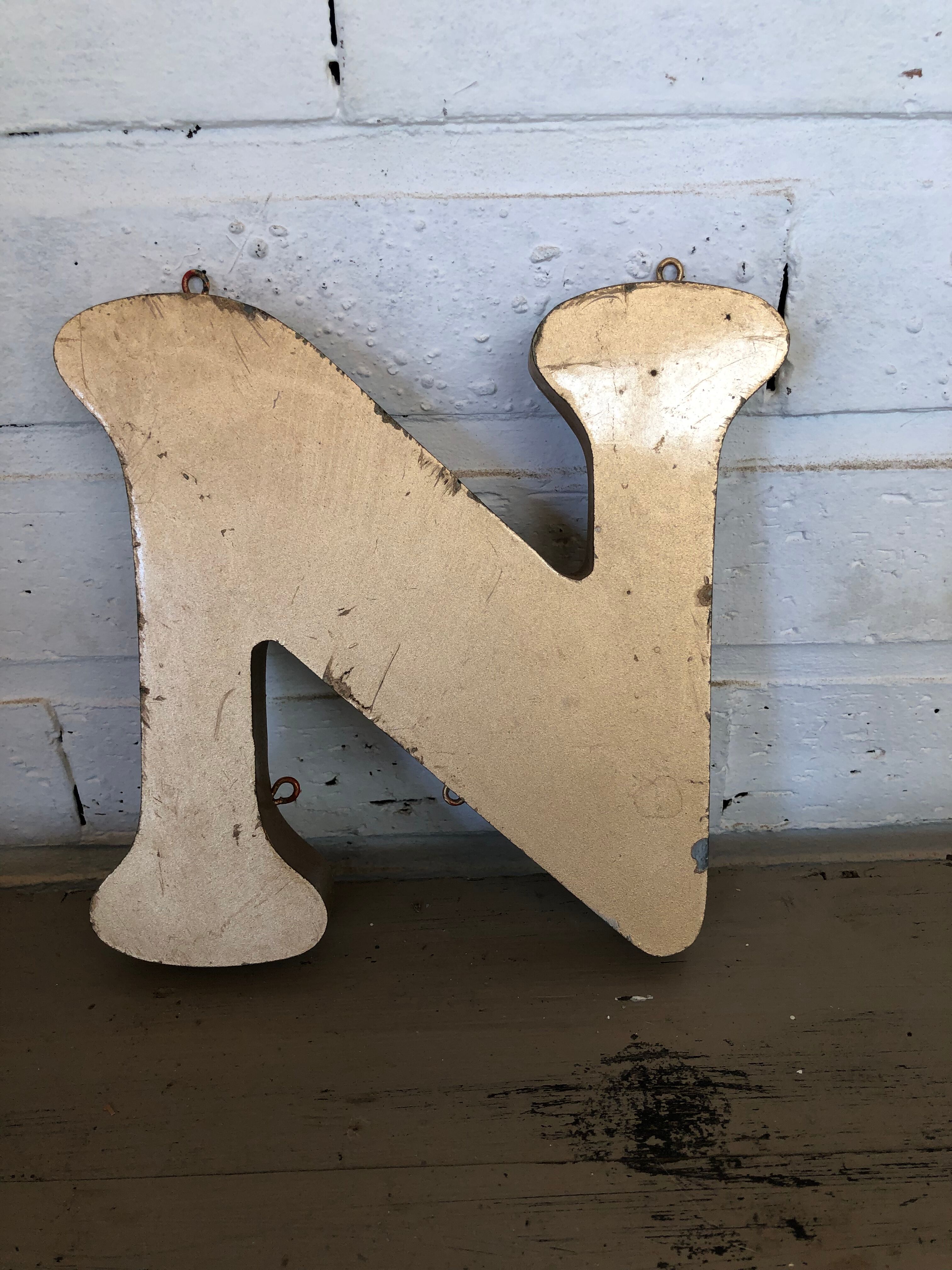 Golden sign letter "N"