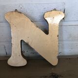 Golden sign letter "N"