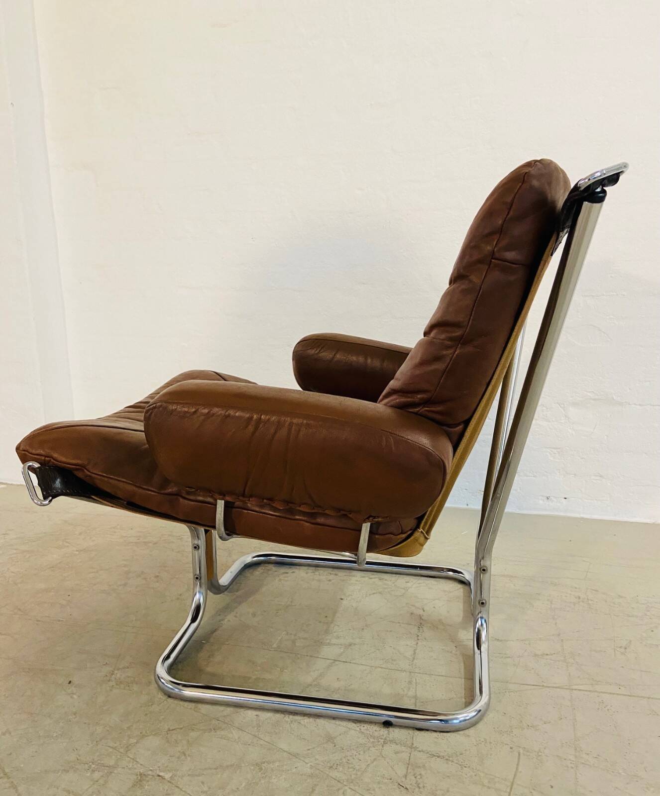 Vintage mid-century Scandinavian cognac leather lounge chair by Harald Relling