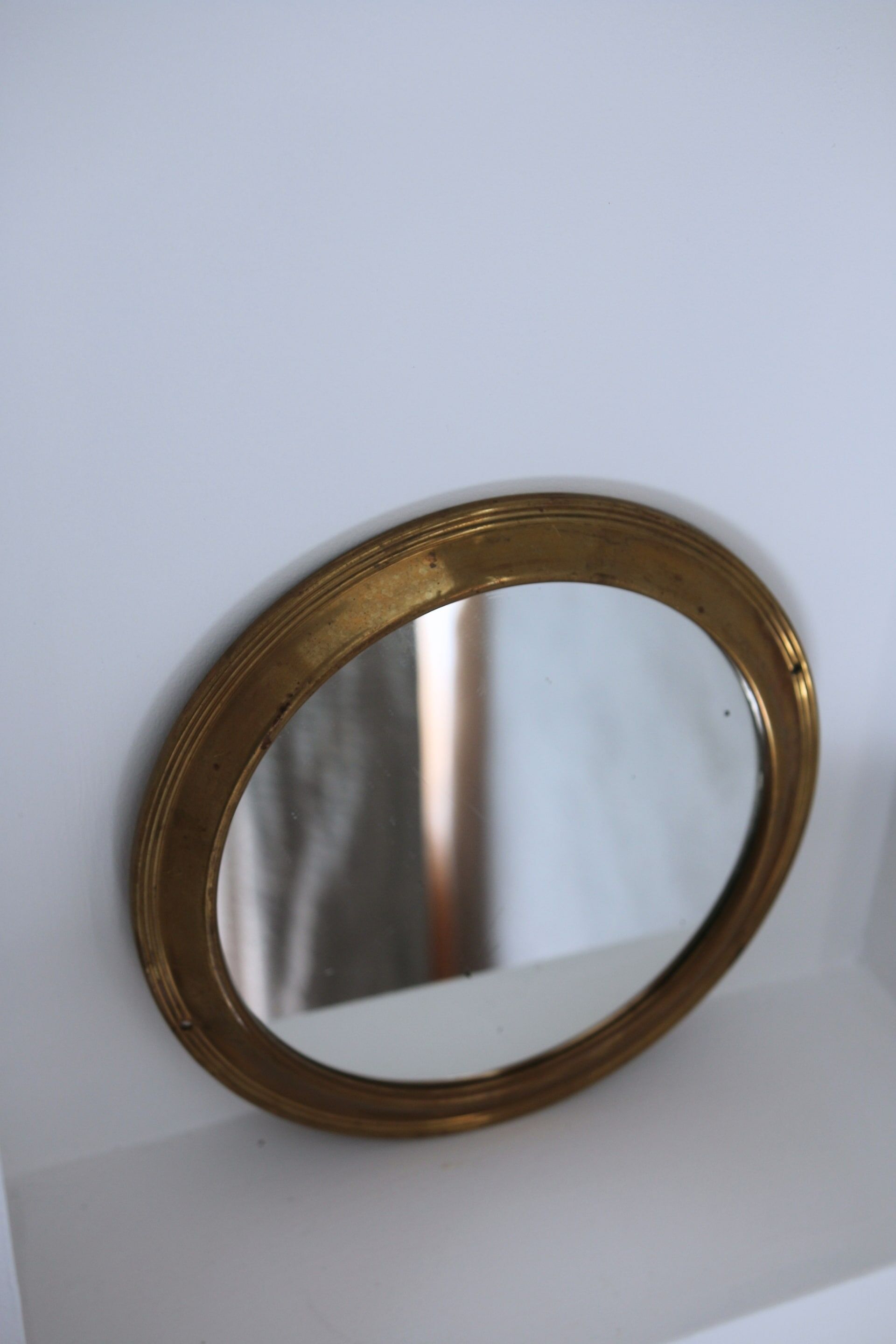 Antique round brass mirror