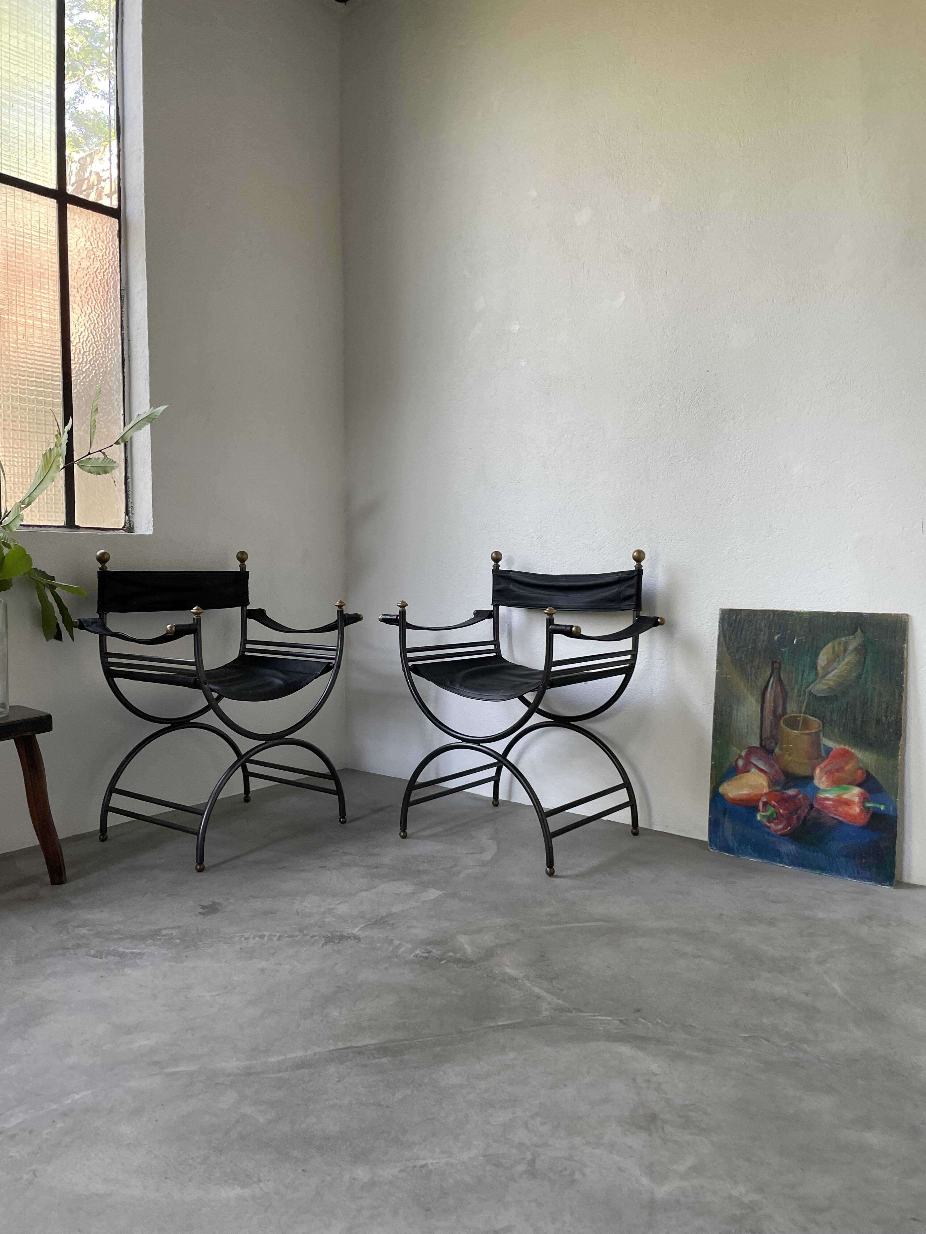 Pair of leather “curule” emperor armchairs