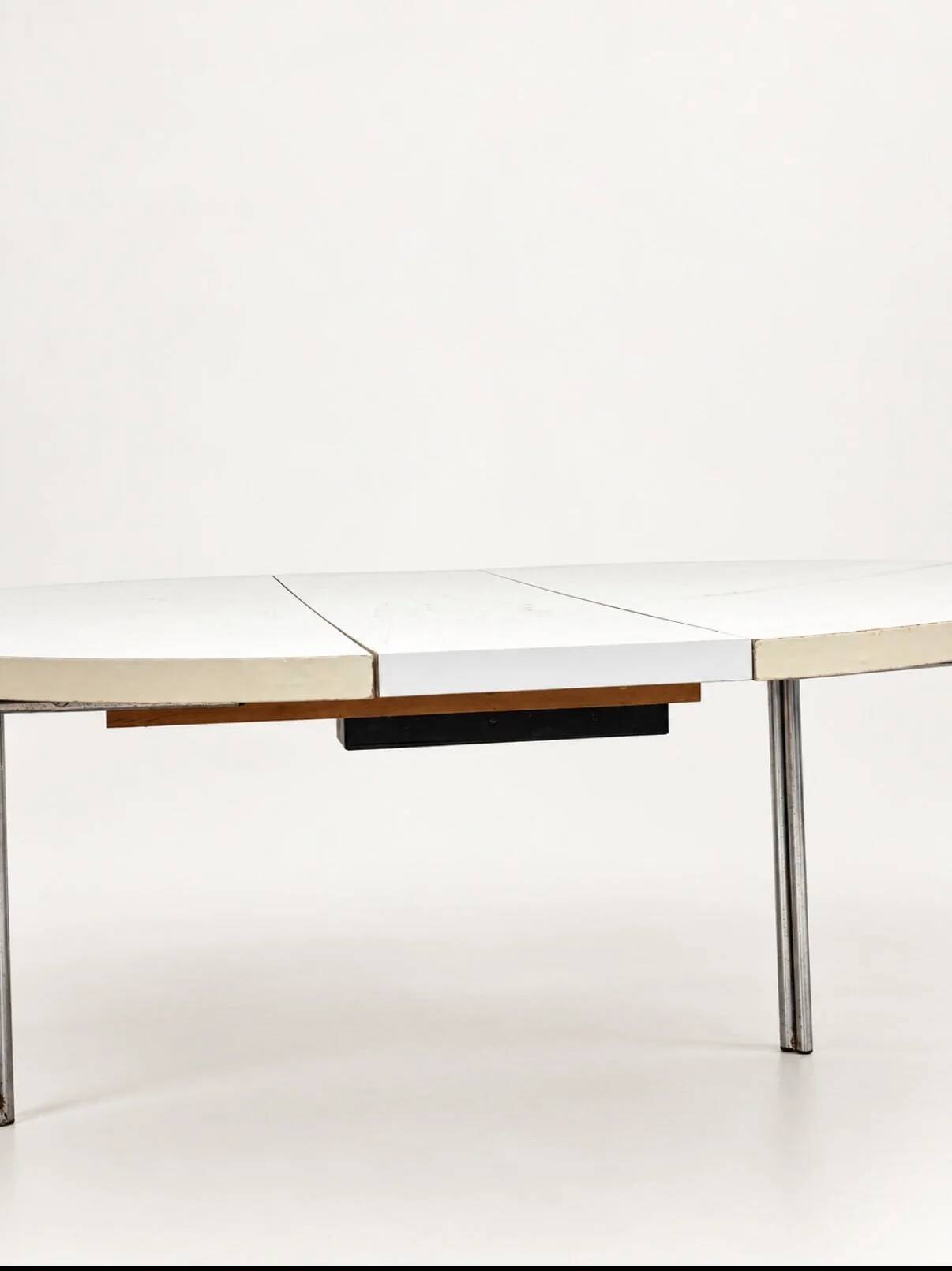 Vintage round extendable dining table, white laminate on chrome legs.