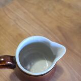 Brown ceramic milk jug