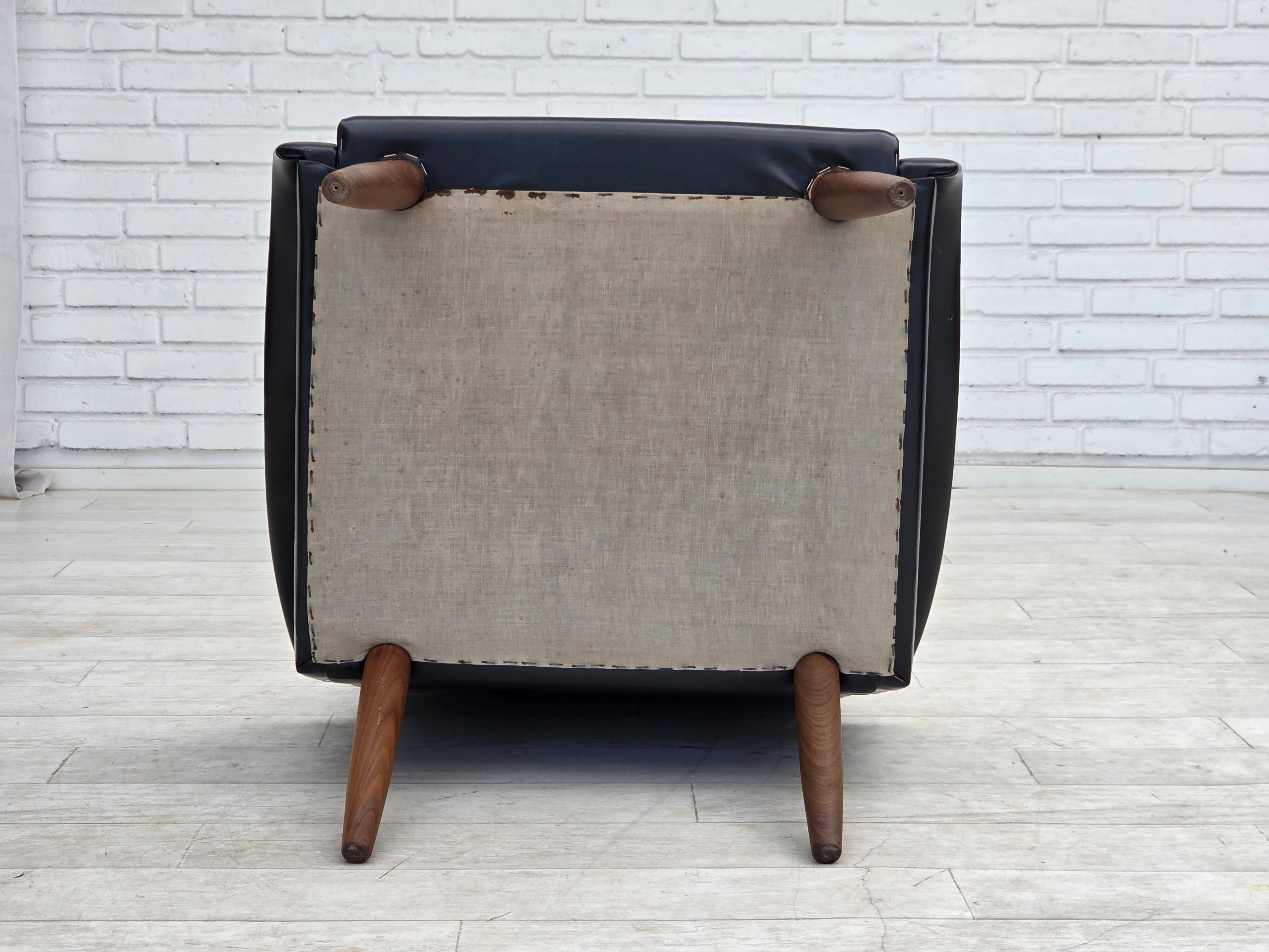 1970s, Danish armchair, black artificial leather, teak wood legs.