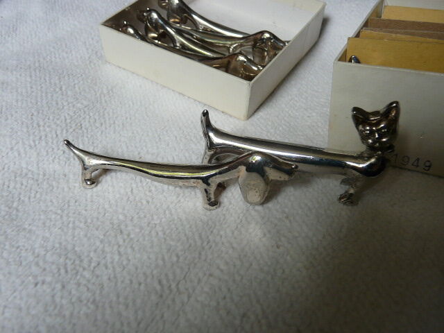 12 silver metal knife holders 6 dogs and 6 cats